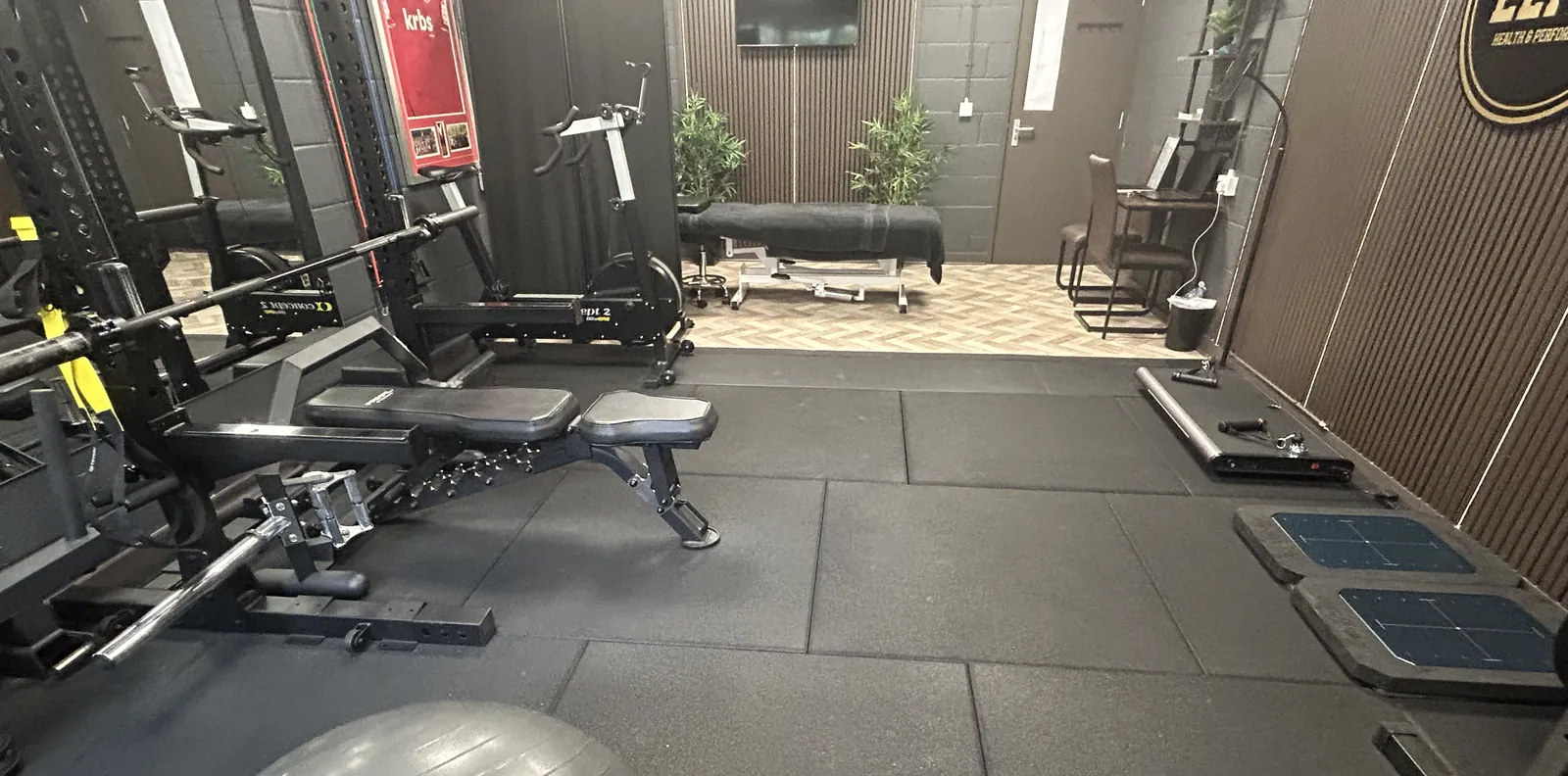 Training floor and treatment area at Elite Health & Performance